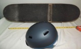 Glass House skateboard with size large Giro helmet.