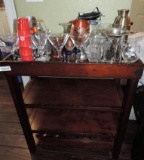 4 tier mini bar with assorted glassware.