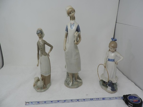 Three Lladro figurines.