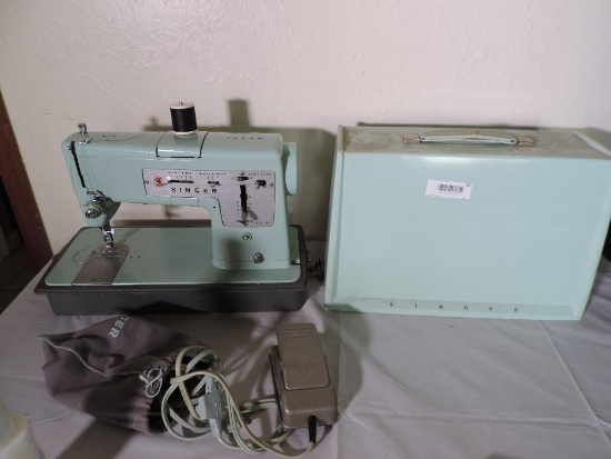 Singer model 338 sewing machine with hardcase.