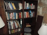 Four shelves loaded with books.