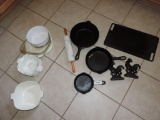 Assortment of cast iron and corningware.