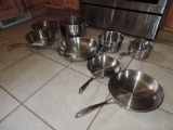 Twelve piece set of Calphalon stainless pots and pans.