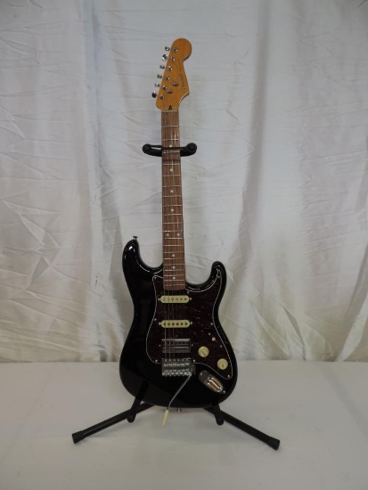 Nice Fender Stratocaster electric guitar with stand.