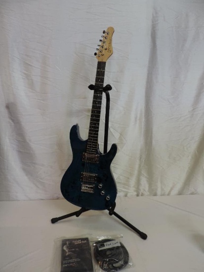 Blue Fretlight 500 series guitar with accessories.