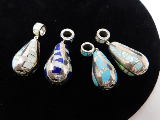 Four Sterling pendants