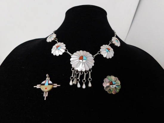 Three pieces of Zuni artwork jewelry