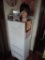 White wooden 5 drawer cabinet with contents.