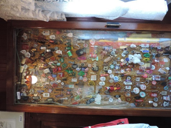 Massive casino keychain collection with display.