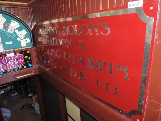 Johnny Nolon's Saloon and gambling emporium sign.