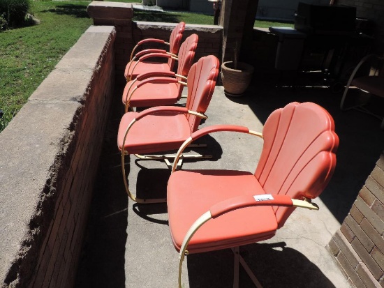 Four vintage metal patio chairs.