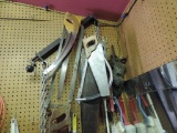 Hand saws and extension cords assortment.