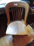 Antique Heywood Wakefield wooden office chair.