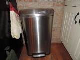 Stainless steel foot pedal trash can.