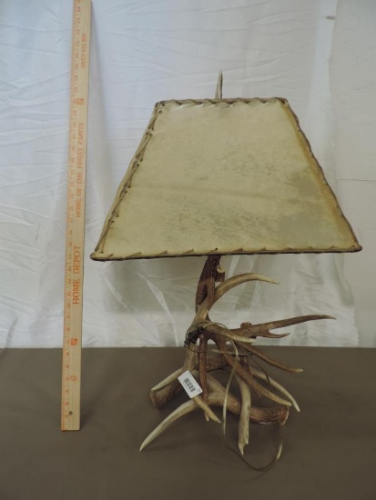 Exceptional antler lamp with leather shade.