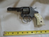 1940's or 50's Bronco six shooter cap gun.