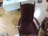 Maroon rocking chair and inlayed plant stand.