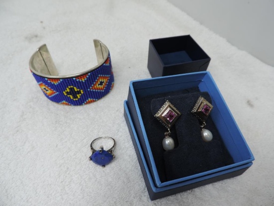 Silver bracelet, ring and earrings.