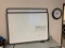 2 white boards and a clock