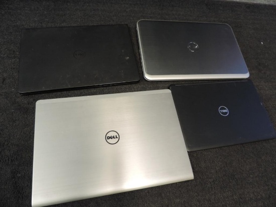 Four Dell laptops for parts or repair.