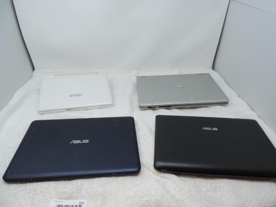 Four small laptops for parts or repair.