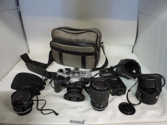 Olympus OM-2 camera with accessories.