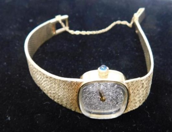 Lucien Piccard 14K gold ladies watch with diamond encrusted face.