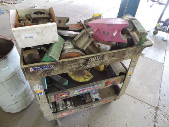 Garage cart loaded with pipe bending heads.