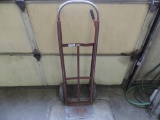 Red hard tire dolly.