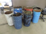 Six metal barrels.