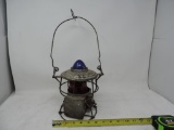 Miners lamp with blue / red glass shades.