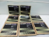 Eight Maxell 35-180 recording tapes.