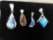 Four artist signed native silver pendants.