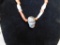 Ground agate bead necklace with stone skull centerpiece