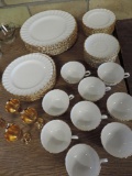Fifty pieces of gold rimmed Spode china.