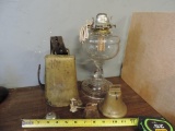 Antique oil lamp and cow bells.