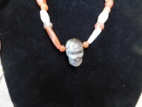 Ground agate bead necklace with stone skull centerpiece
