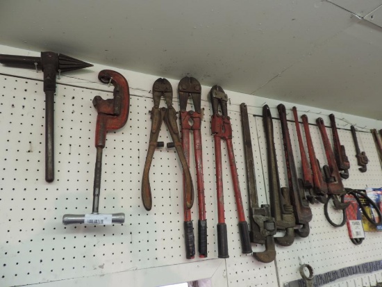 Bolt cutters / pipe wrenches.