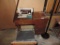 Signature sewing machine with cabinet and notions.