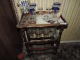 Small wooden wine rack with glassware.