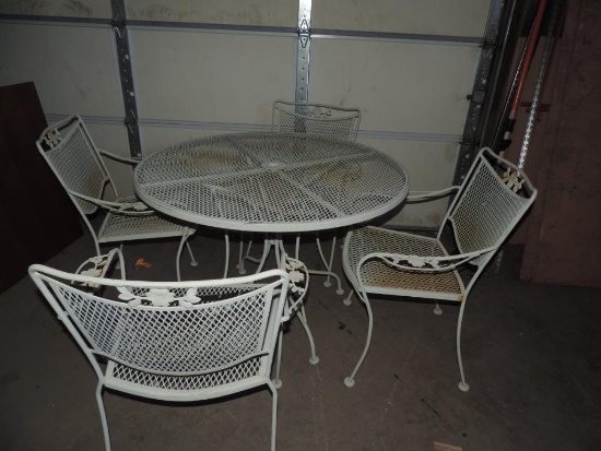White metal patio table with 4 chairs.