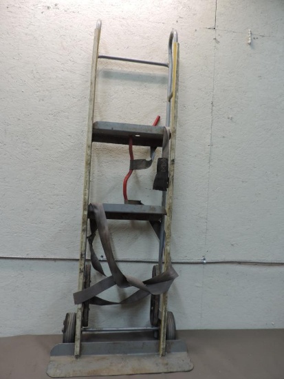 Gray hard tire appliance hand truck.