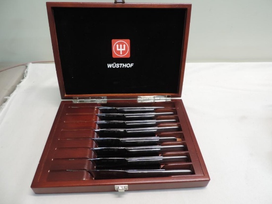 Eight Wusthof Trident knives with wooden case.