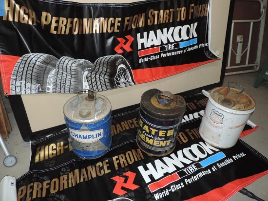 Three vintage 5 gallon cans with Hankook Tire banners.