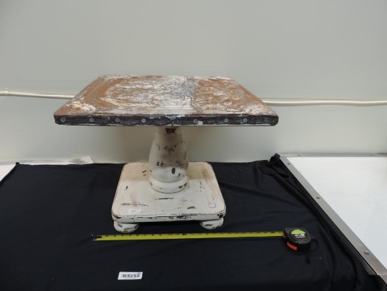 Antique ceiling tile top side table.