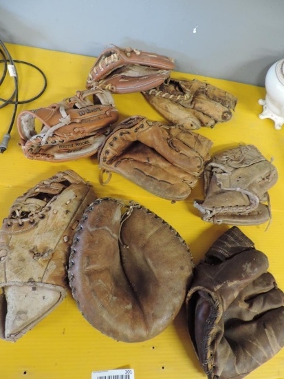Antique baseball gloves.