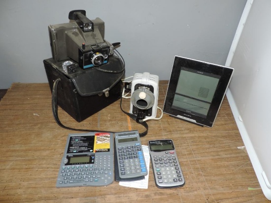 Calculators and polaroid land camera.