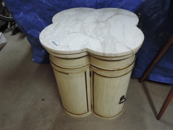 Stone top clover leaf style end table.