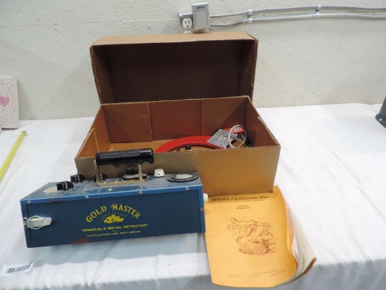 White's GM64T metal detector.