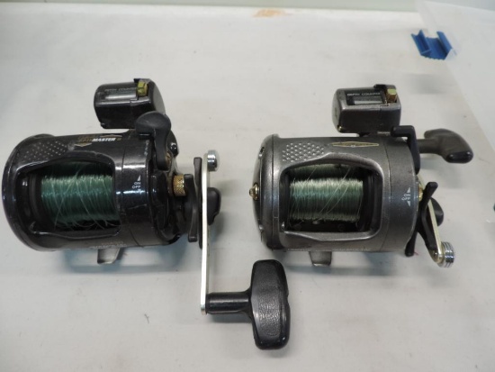 Two Cabela's Depthmaster 2 baitcaster reels.